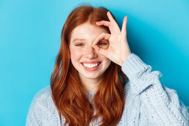 Cheerful red-haired woman making an 'OK' hand gesture