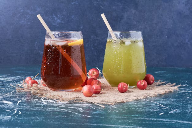 Two refreshing fruit based drinks with garnishes