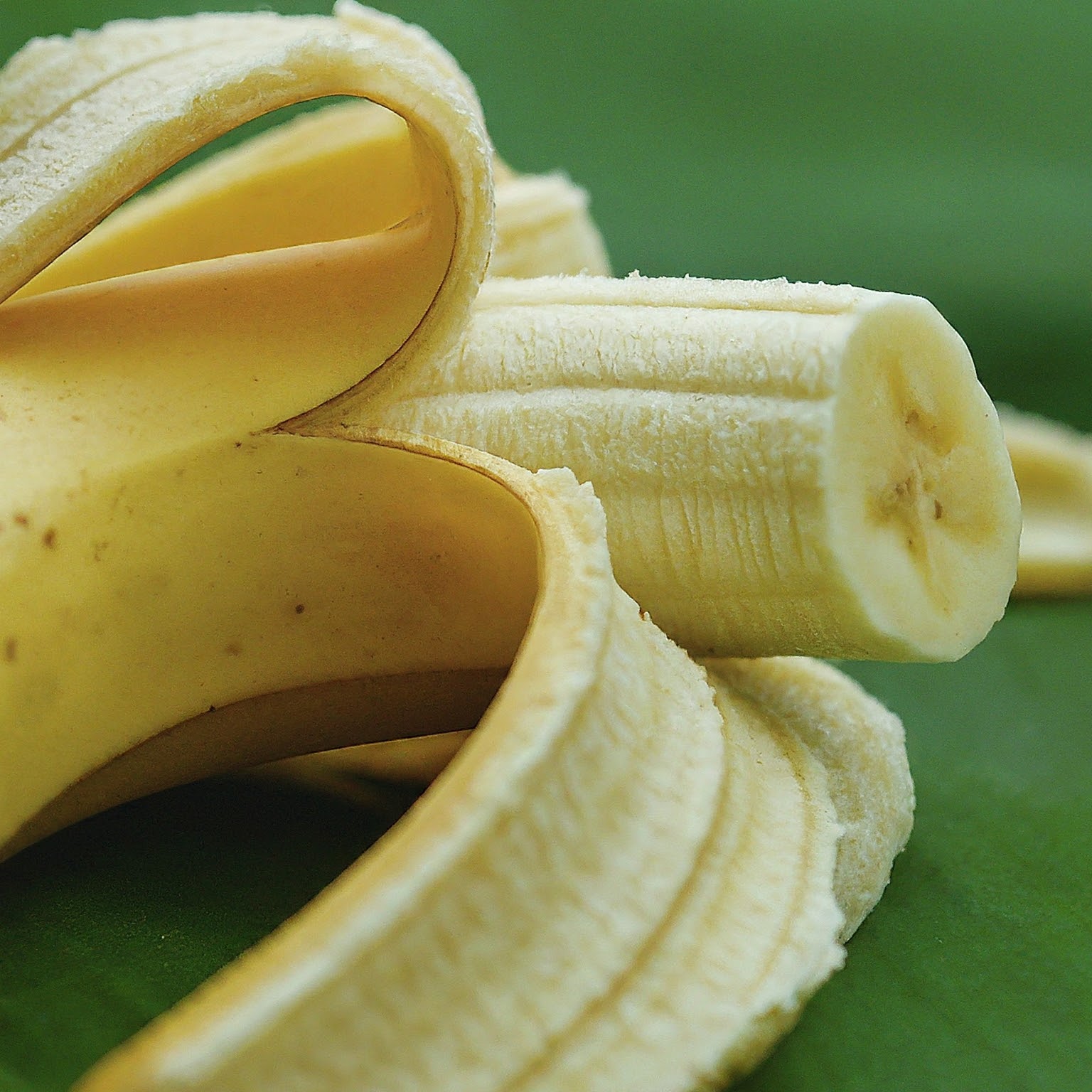 A close-up of a peeled and half-eaten banana