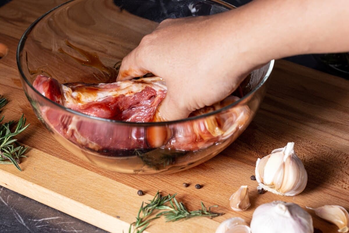 Chef S Hand Marinated Fresh Beef Glass Cup Steaks Marble Table Closeup