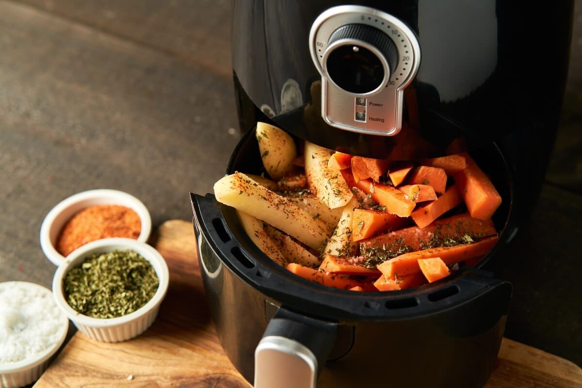 Cooking Potatoes Carrot Sticks With Spices Air Fryer