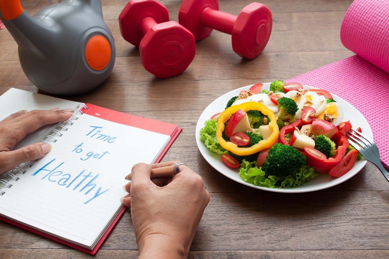 Plate of veggies with dumbbells