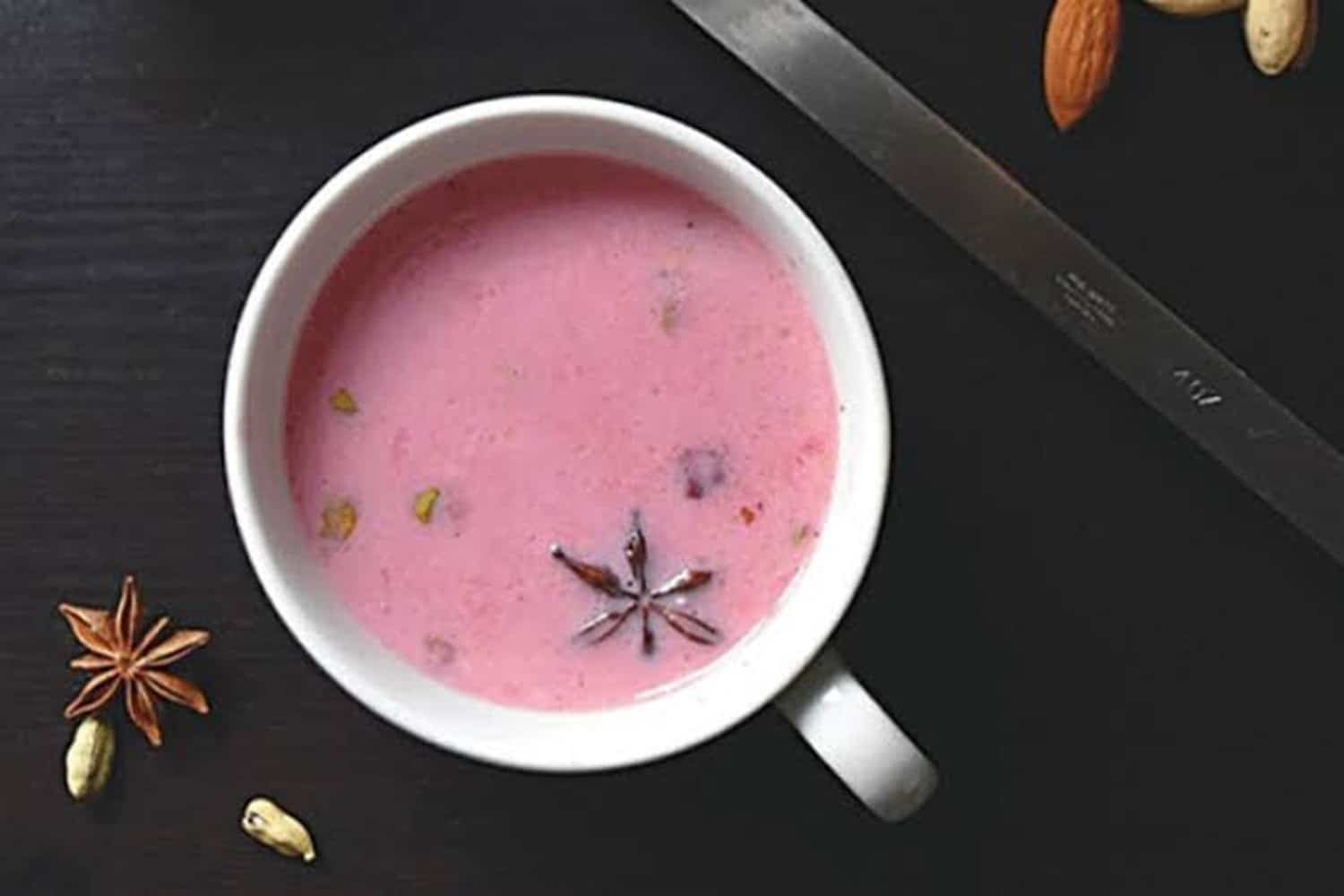 Pink Kashmiri noon chai in a ceramic cup