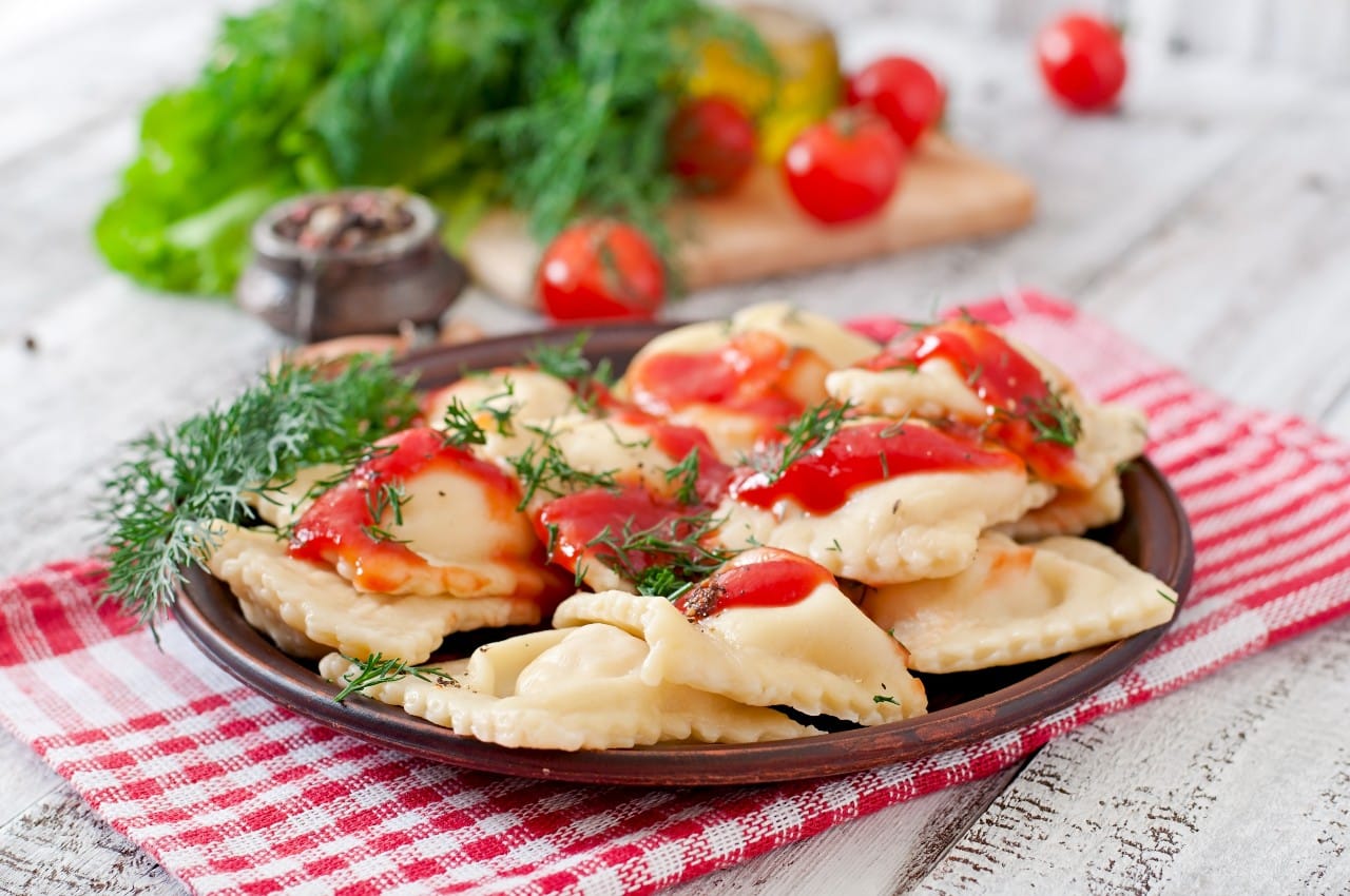 delicious ravioli with tomato sauce dill