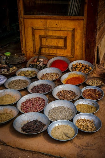 An assortment of colourful Indian spices arranged in small bowls 