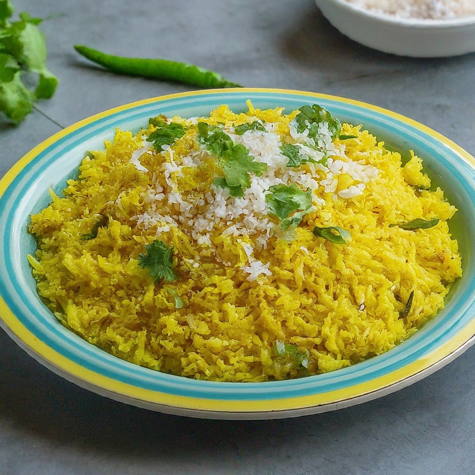 bowl of hot ready to eat lemon rice with coriander garnishing on top