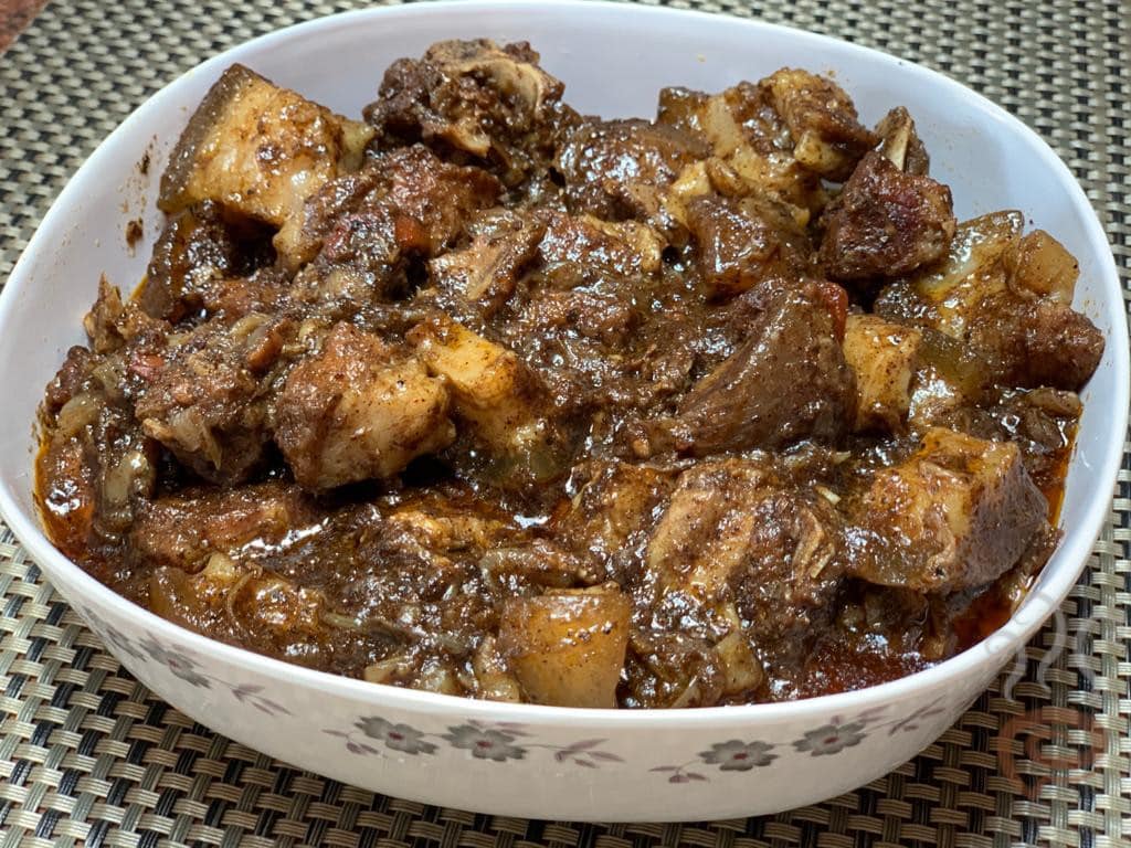 A bowl of pandi curry set on the table