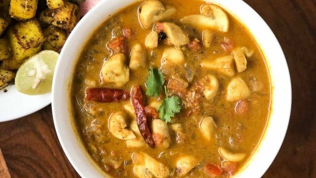 Chennai style kummu curry poured in a white bowl