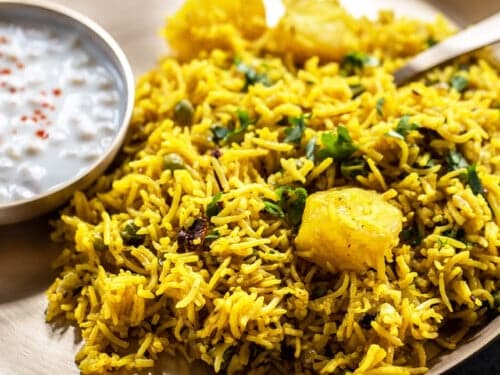 Tehri veg yellow coloured rice mixed with peas