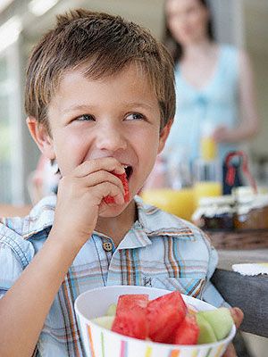 Kid eating a watermelon